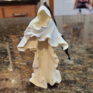 Elegant White Hooded Figurine